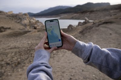 World Wetlands Day in Spain's Girona A person shows the map on the phone at the Darnius-Boadella swamp, on the Muga river, one of the clearest examples of lack of water in the Mediterranean region.